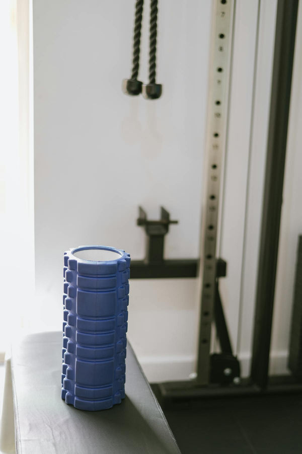 Blue muscle roller on bench