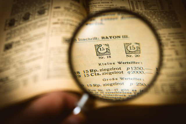 Magnifying glass over book