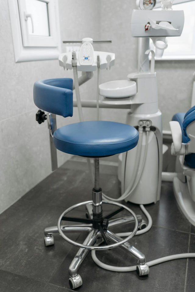 Blue dentist chair stool